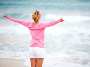 Woman in pink at beach